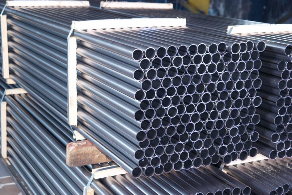Steel Pipes Bunch On The Rack In Warehouse